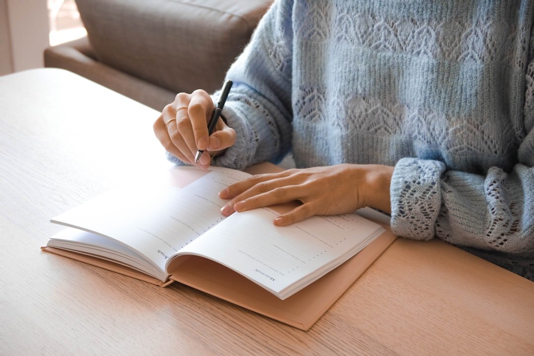 woman writing in journal