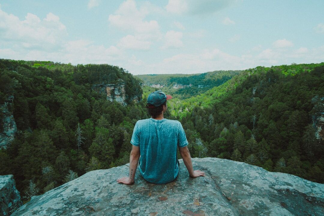 person meditating in nature
